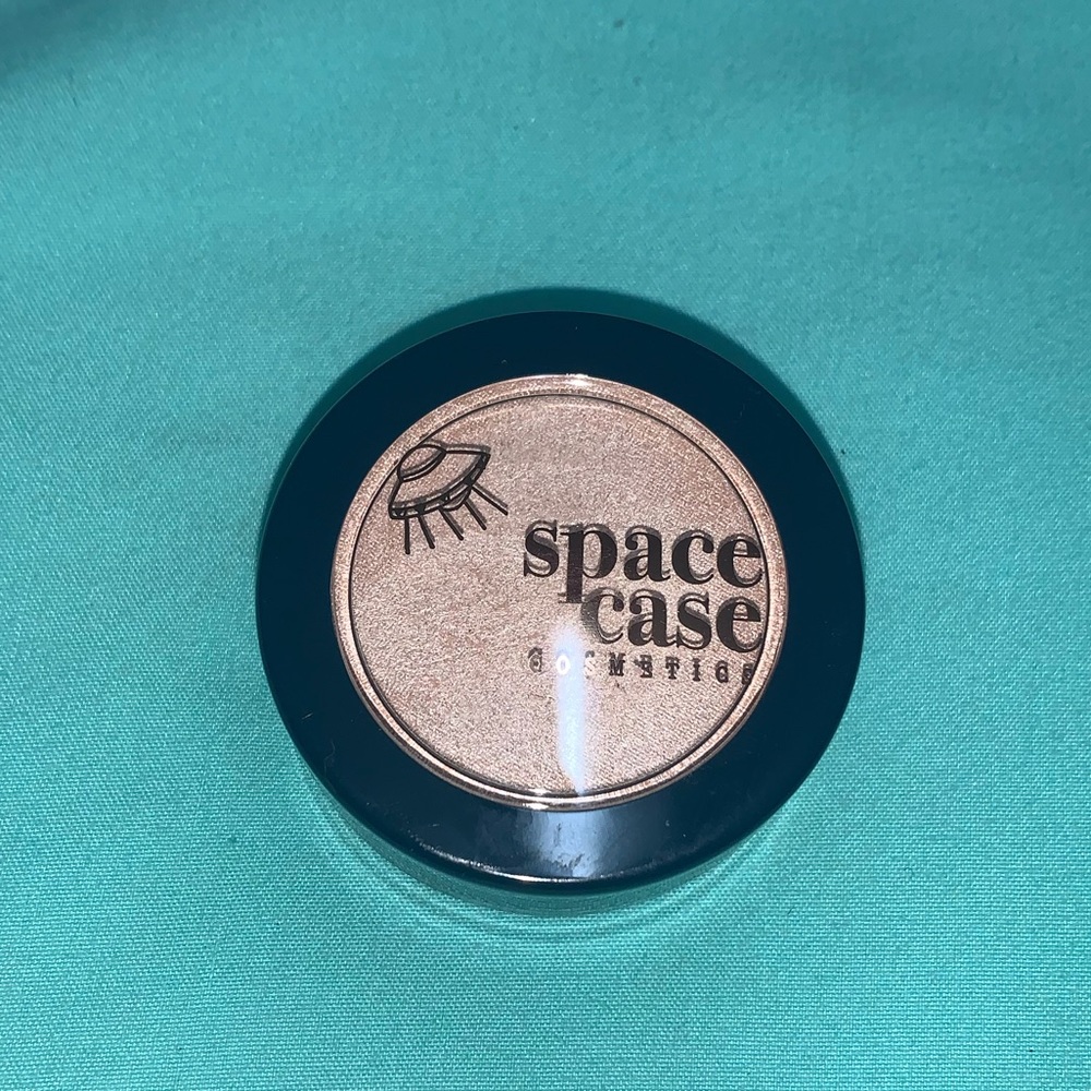 space case cosmetics highlighter